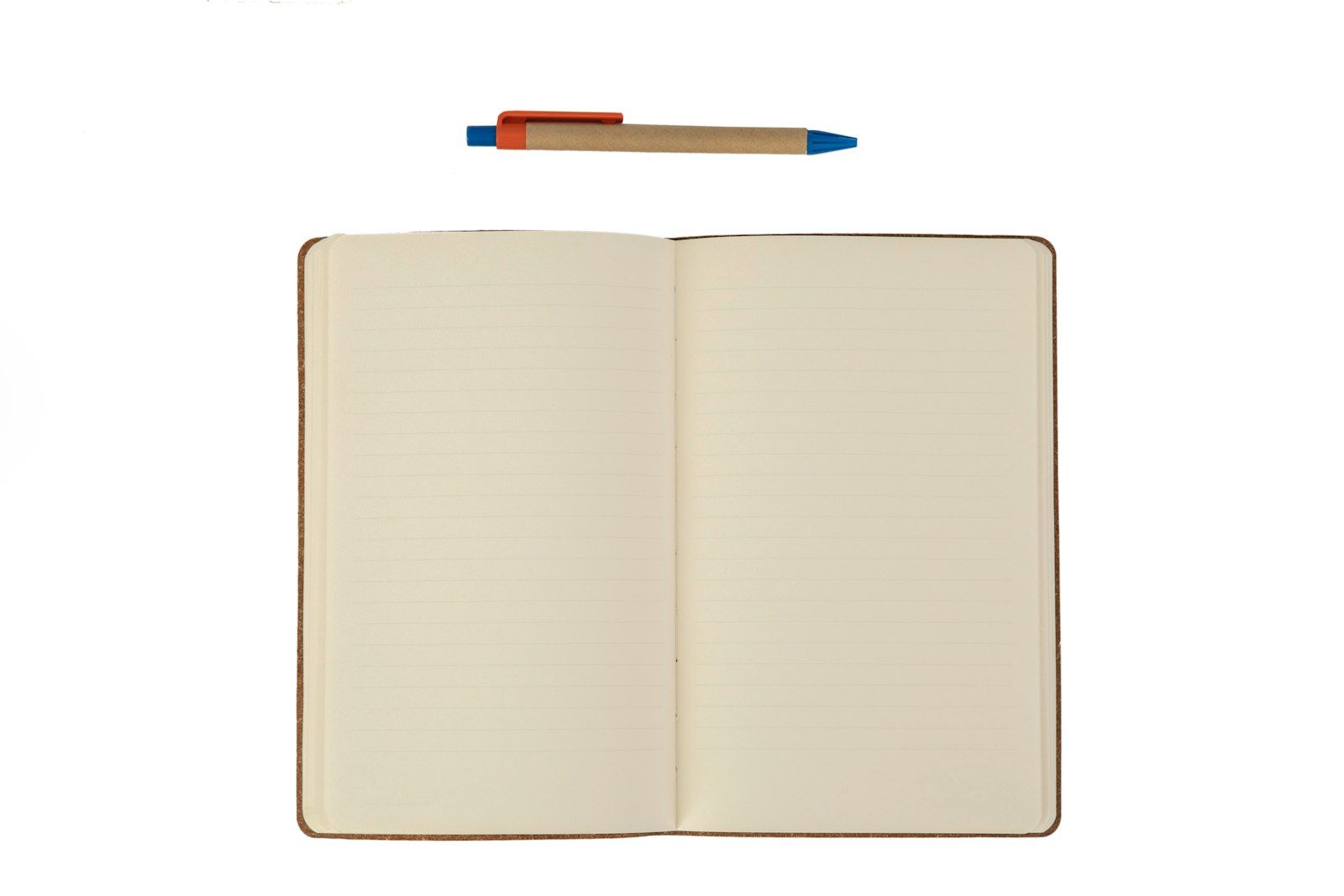 An open ruled notebook with a pen above it